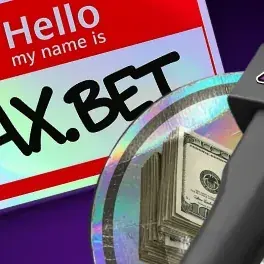 Hache et logo AX.BET posés sur des liasses d'euros